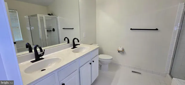 a bathroom with a tub and a shower