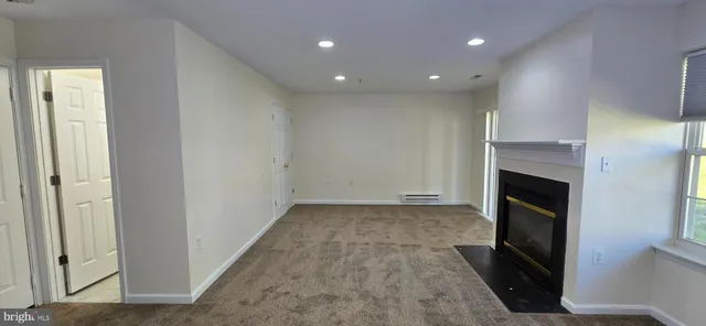 an entryway in a hall with a window