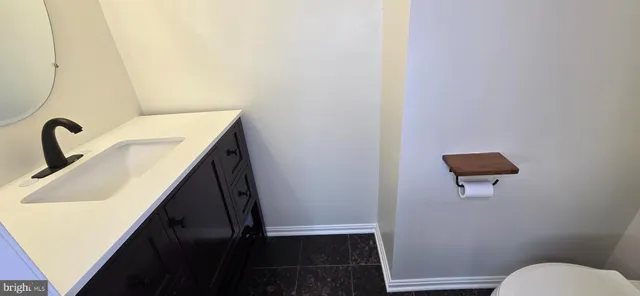 a bathroom with a sink and mirror