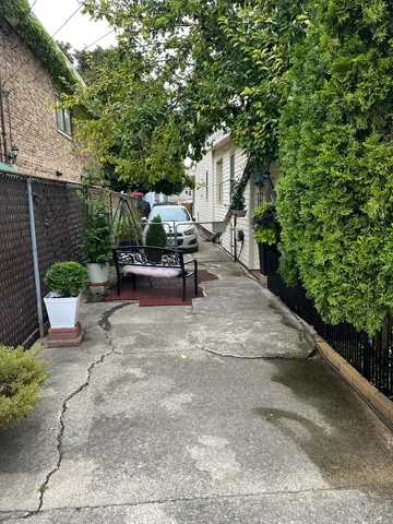 a view of a patio with table and chairs and potted plants