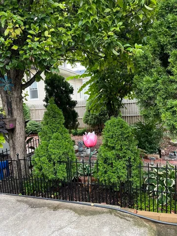a front view of a house with yard