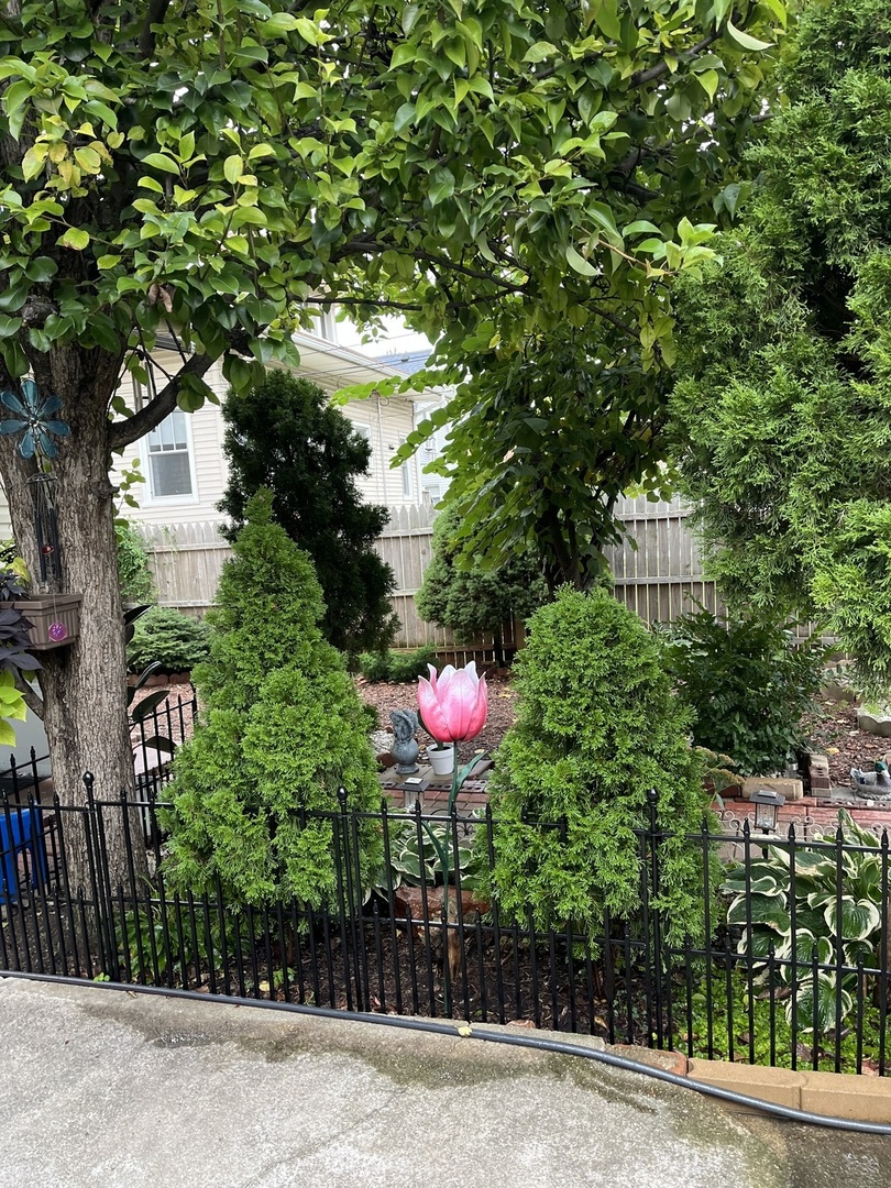 3331 West 64th Street Chicago, IL 60629 - Photo 14 of 15 a front view of a house with yard