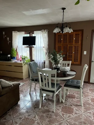 a view of a dining room with furniture