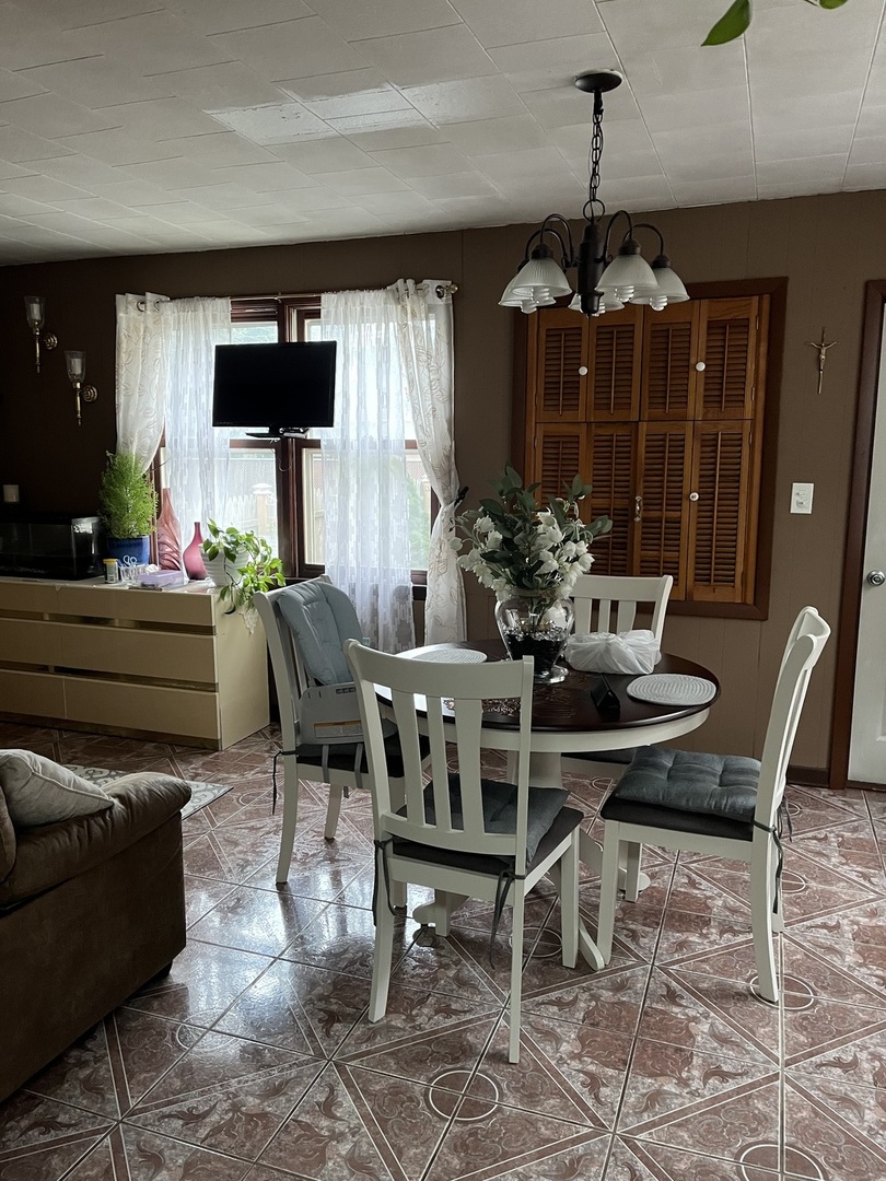 3331 West 64th Street Chicago, IL 60629 - Photo 6 of 15 a view of a dining room with furniture
