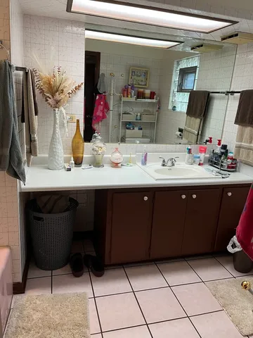 a room with a sink and a mirror
