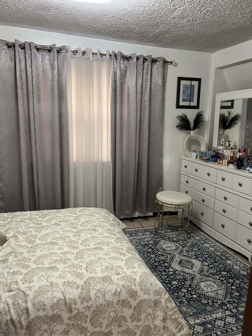 3331 West 64th Street Chicago, IL 60629 - Photo 9 of 15 a bathroom with a sink toilet and shower