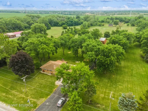 a view of a yard with an outdoor space