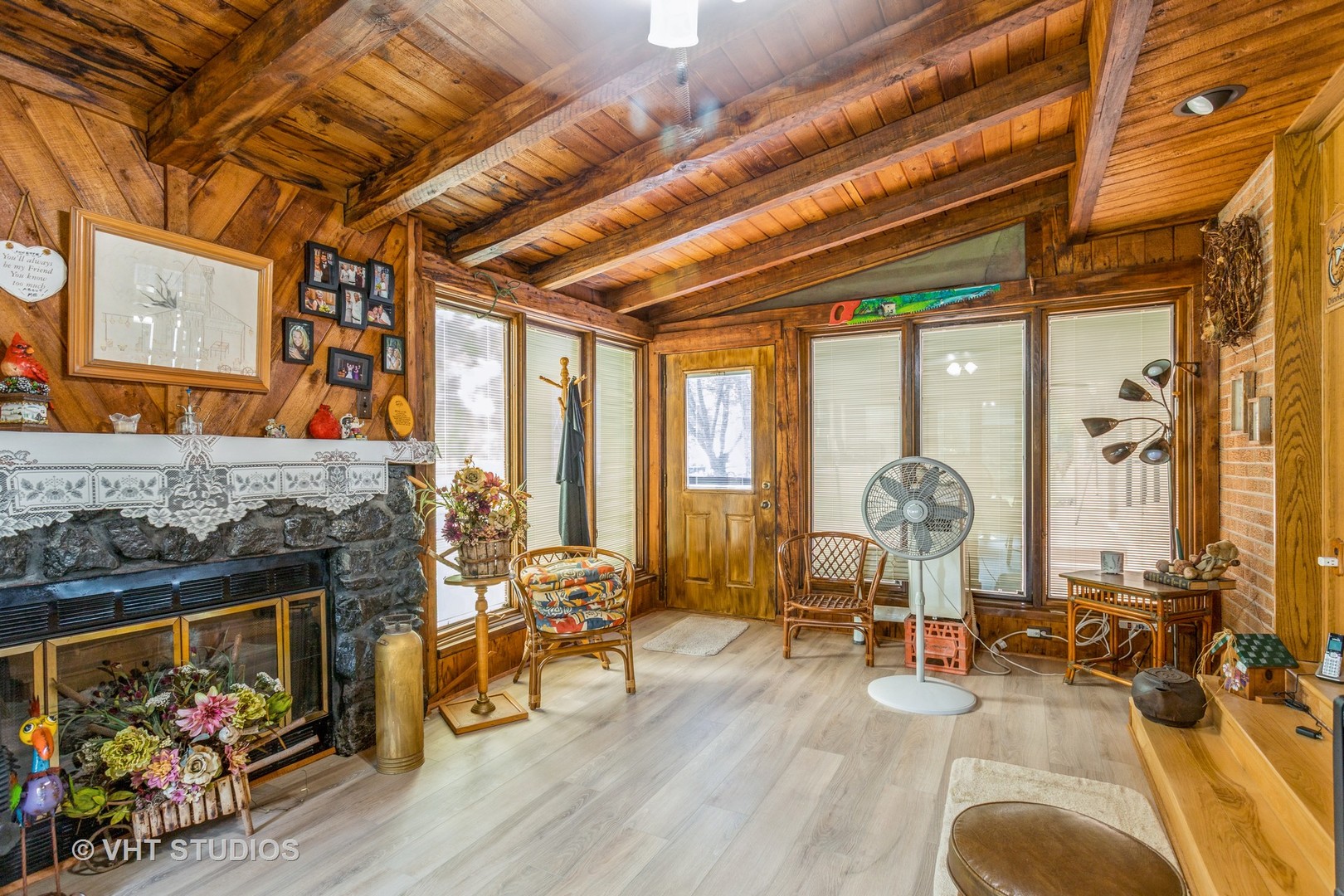 14119 West Maple Road Mokena, IL 60448 - Photo 14 of 47 a living room with fireplace furniture and a floor to ceiling window