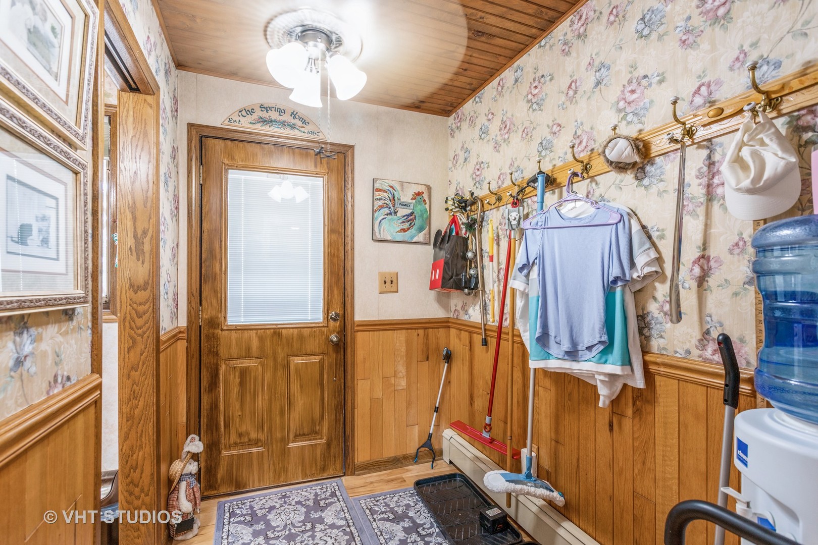 14119 West Maple Road Mokena, IL 60448 - Photo 15 of 47 a view of a hallway with paintings on the wall