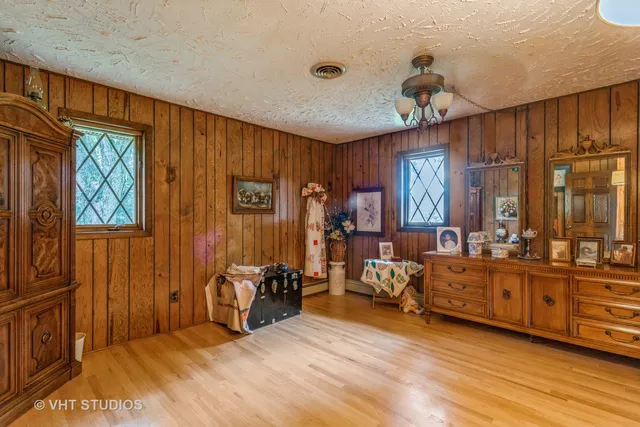 a bedroom with furniture and a window