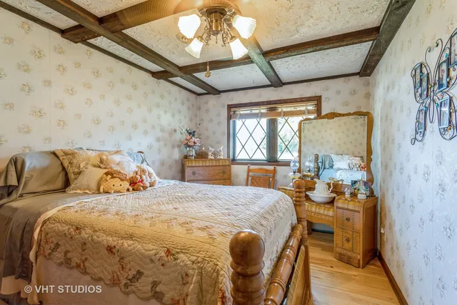 a bedroom with double bed and a window