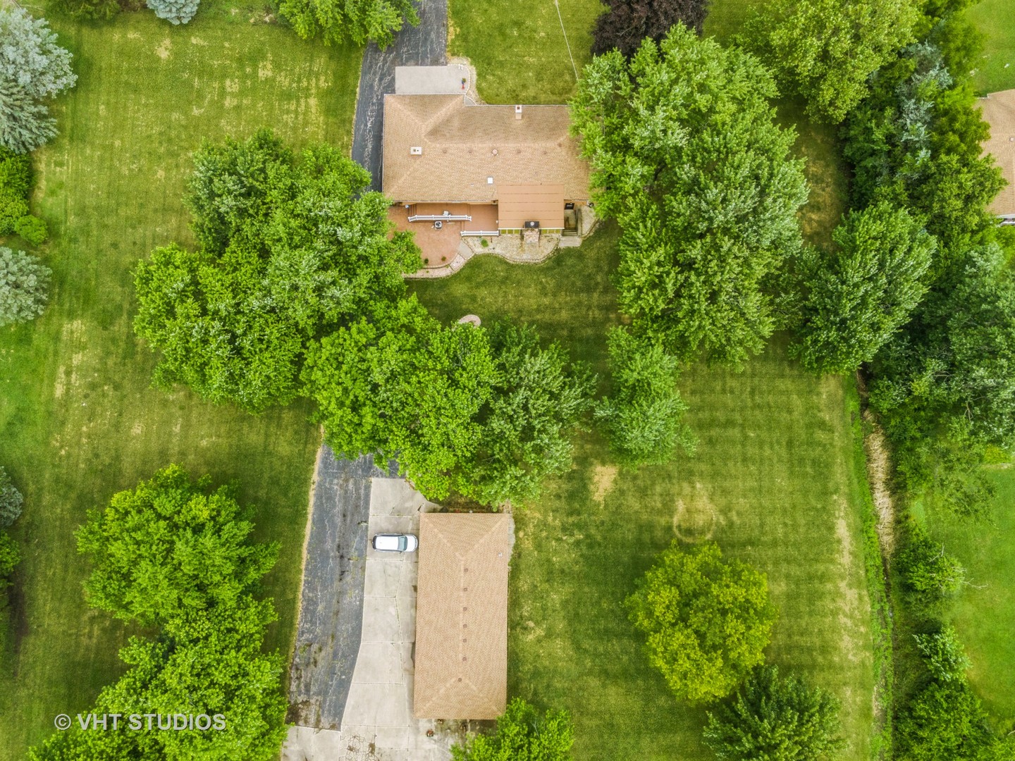 14119 West Maple Road Mokena, IL 60448 - Photo 44 of 47 an aerial view of a house with a yard and garden