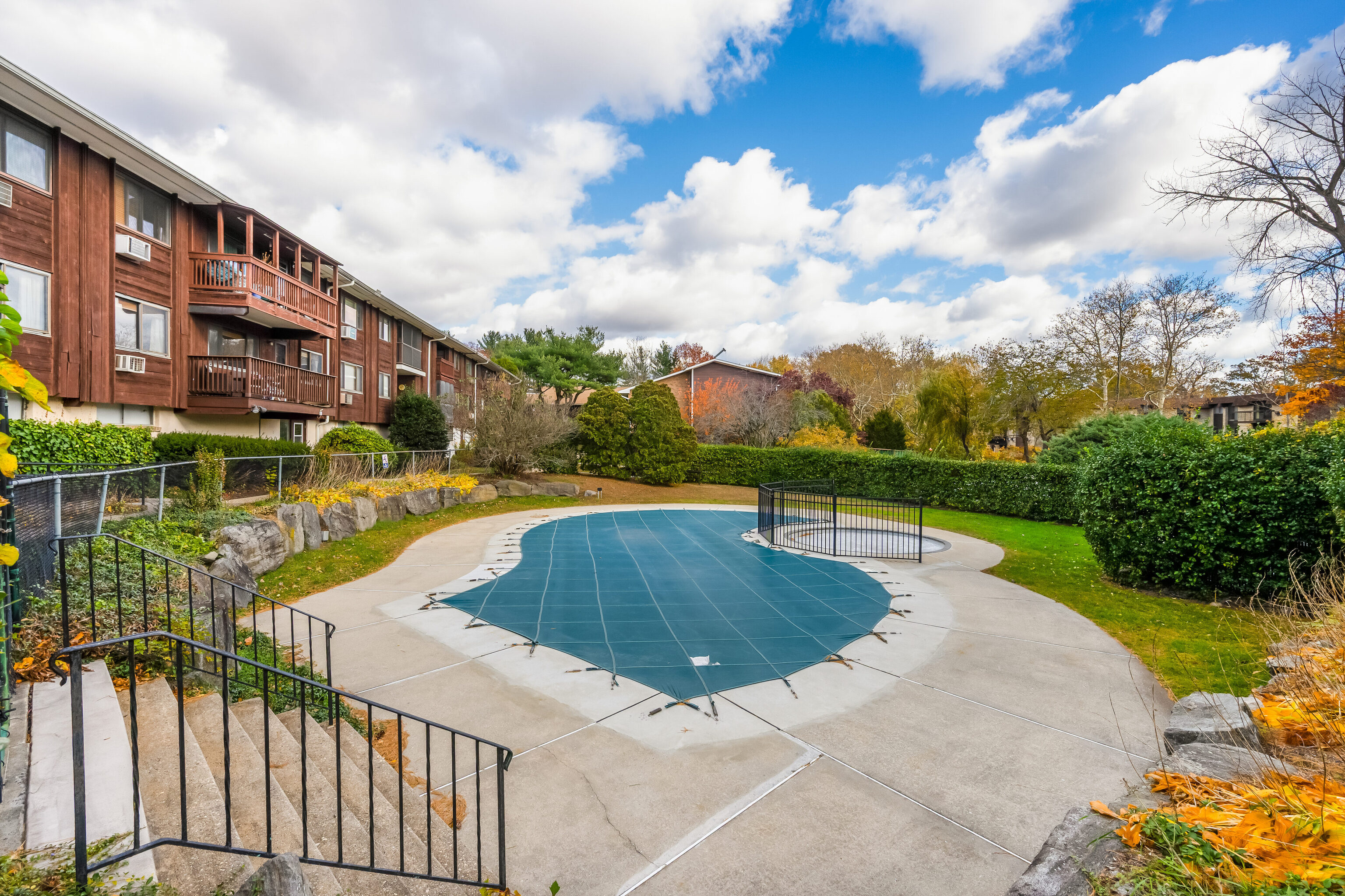 154 Cold Spring Road, Unit 71 Stamford, CT 06905 - Photo 16 of 19 a view of swimming pool from a garden