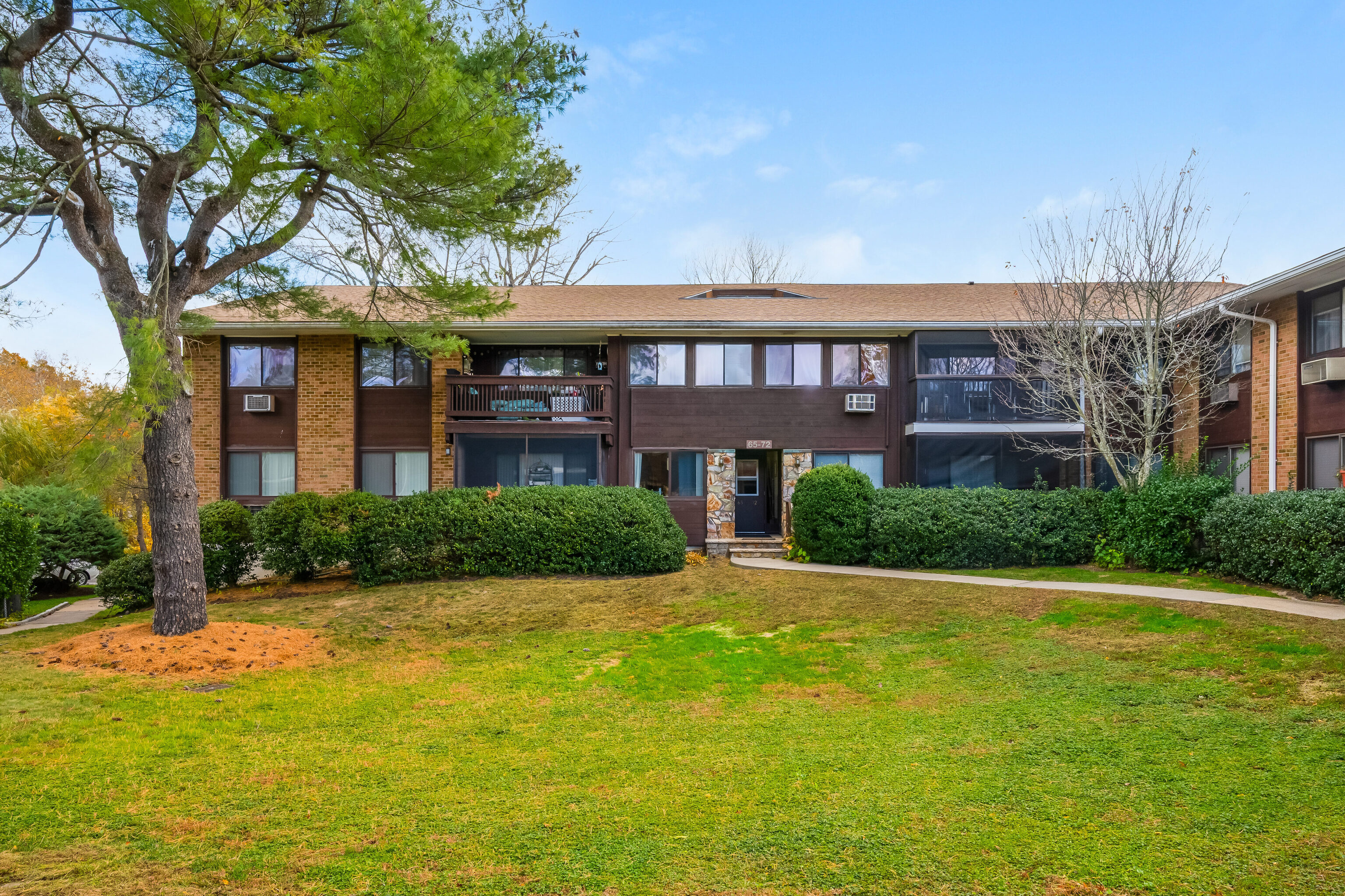 154 Cold Spring Road, Unit 71 Stamford, CT 06905 - Photo 18 of 19 a front view of a building with garden