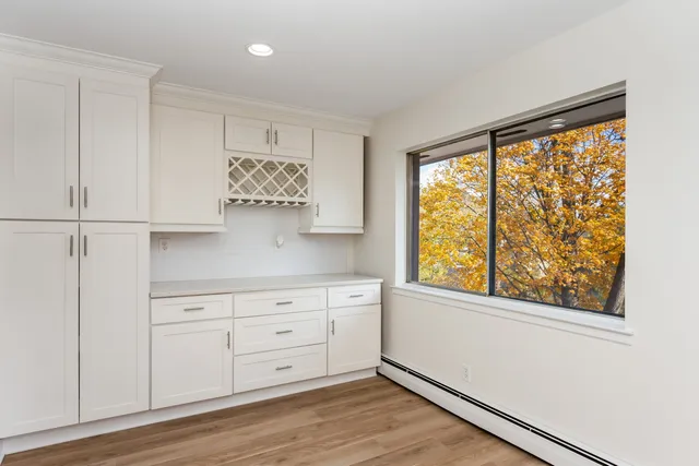 a view of cabinets and wooden floor