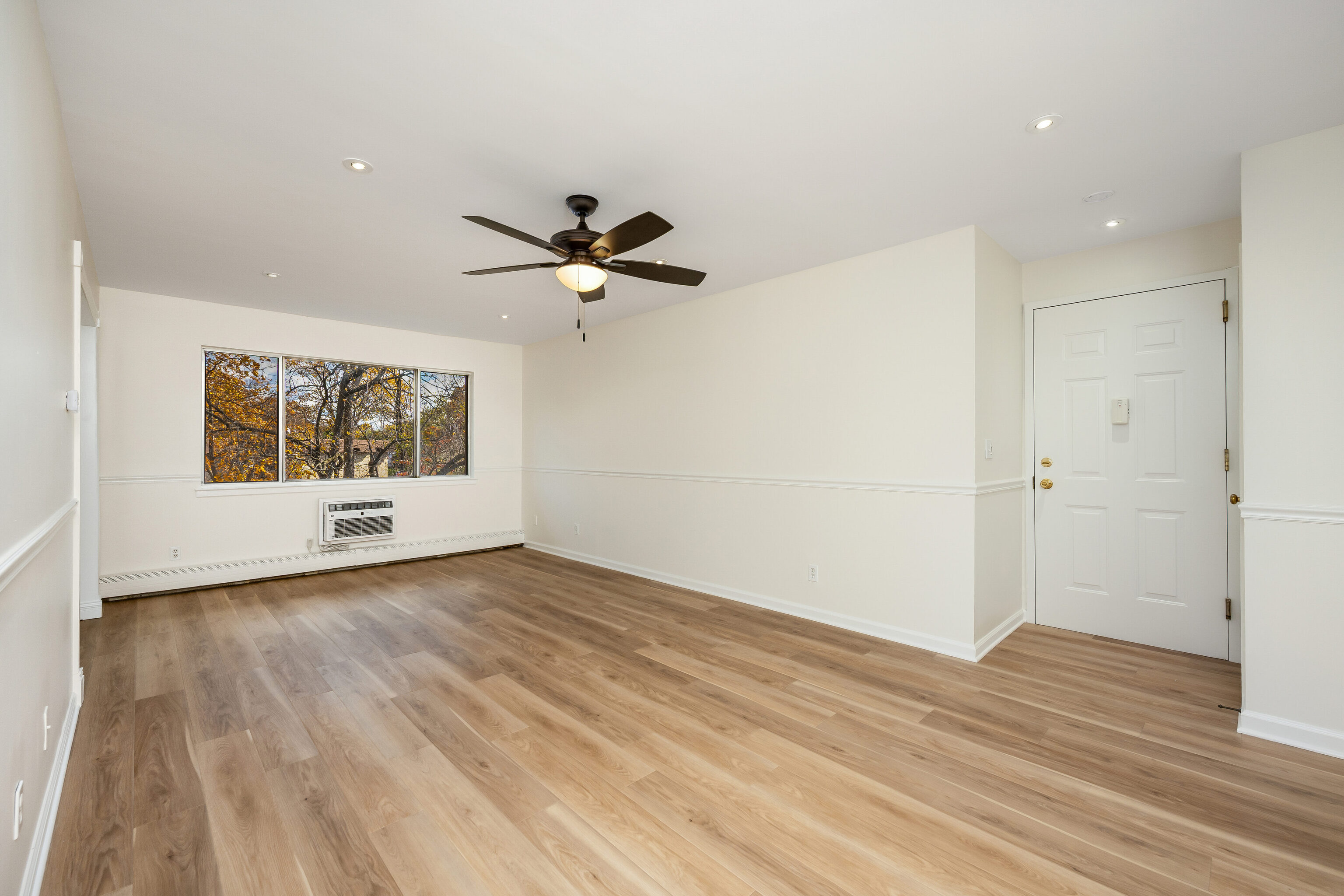154 Cold Spring Road, Unit 71 Stamford, CT 06905 - Photo 6 of 19 wooden floor in an empty room with a window