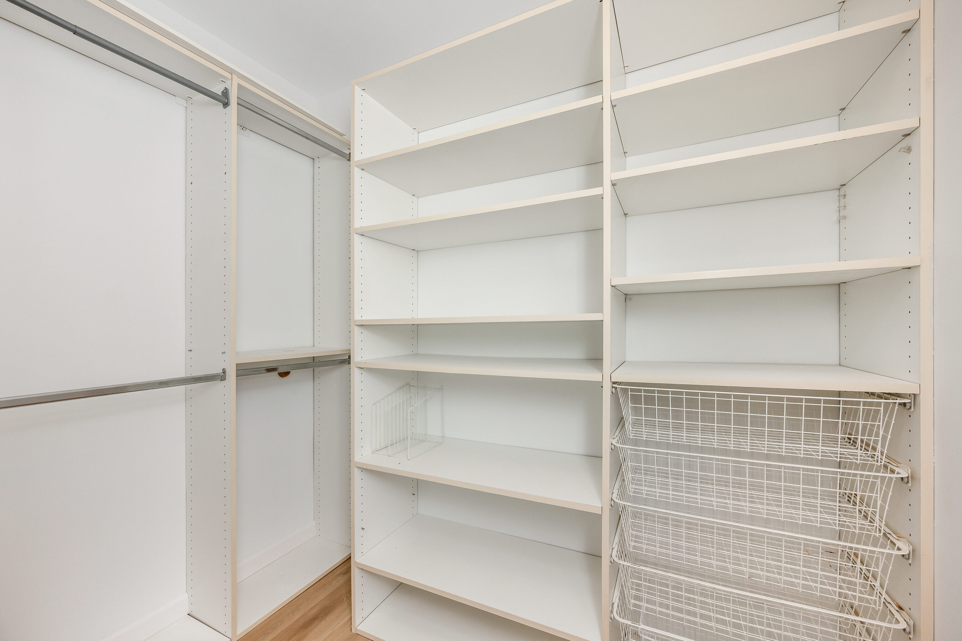 154 Cold Spring Road, Unit 71 Stamford, CT 06905 - Photo 8 of 19 a view of walk in closet with empty racks