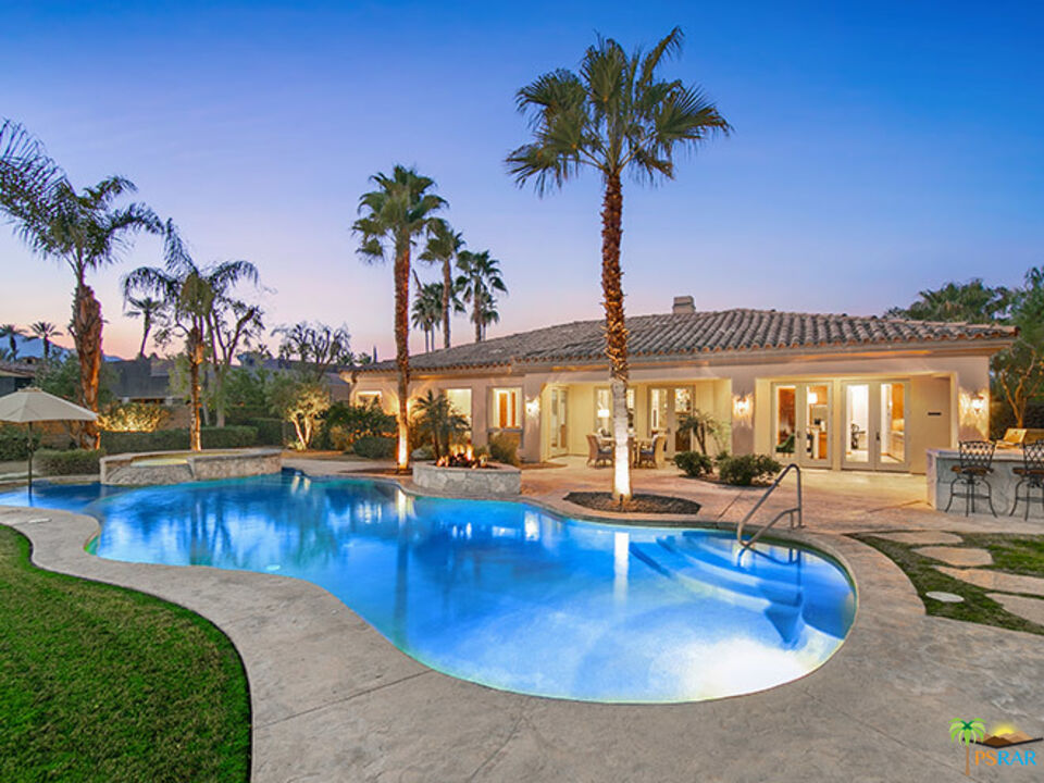 72733 Verbenia Road Rancho Mirage, CA 92270 - Photo 1 of 33 a view of a swimming pool with a table and chairs