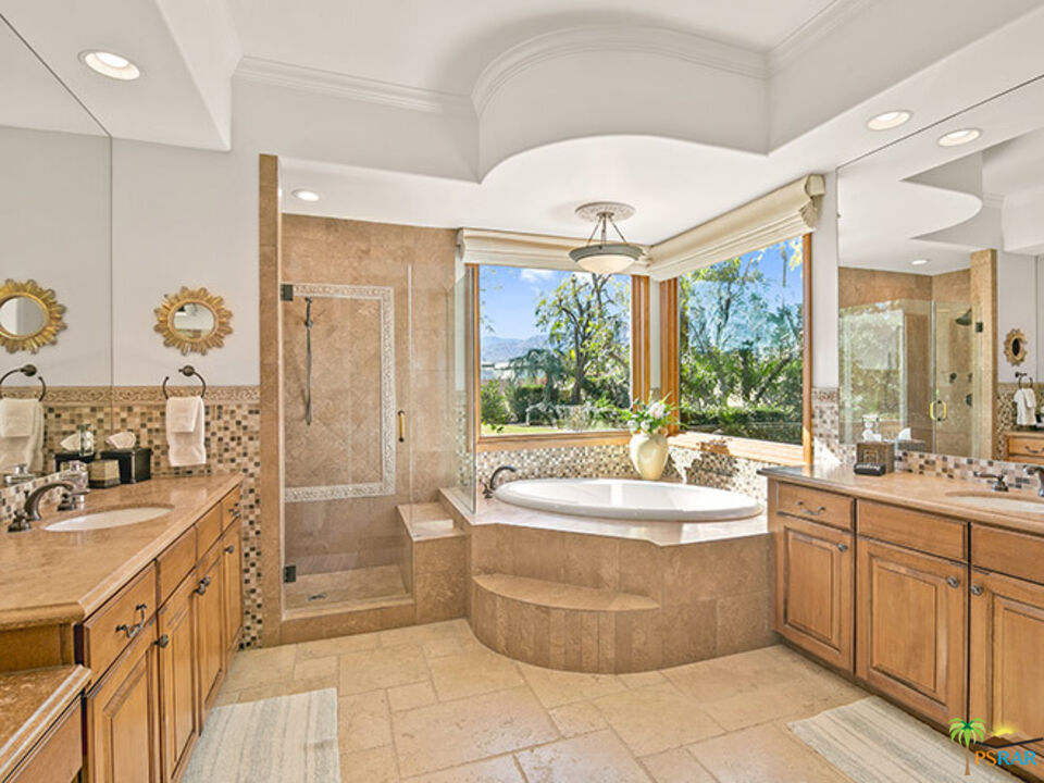 72733 Verbenia Road Rancho Mirage, CA 92270 - Photo 12 of 33 a large spacious bathroom with a large tub a sink and large window