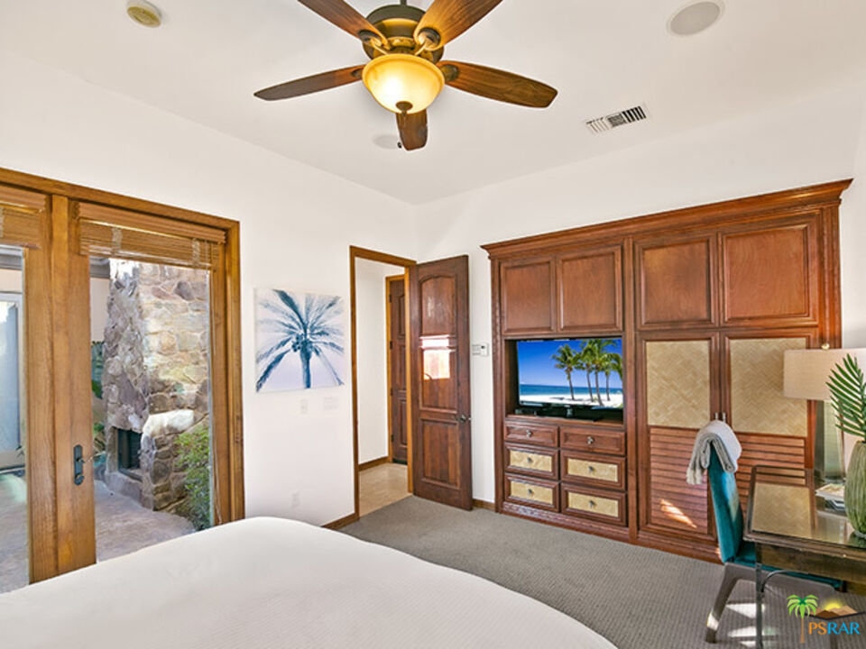 72733 Verbenia Road Rancho Mirage, CA 92270 - Photo 13 of 33 a bedroom with furniture and a window
