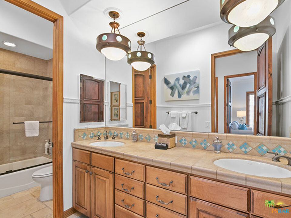 72733 Verbenia Road Rancho Mirage, CA 92270 - Photo 19 of 33 a bathroom with a sink and a mirror