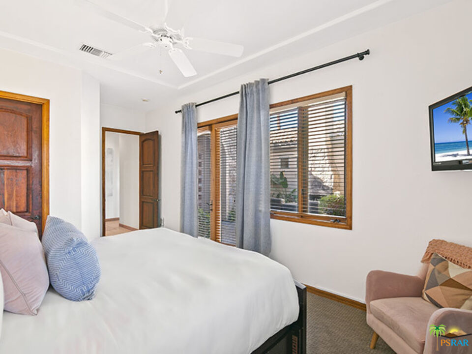 72733 Verbenia Road Rancho Mirage, CA 92270 - Photo 20 of 33 a bedroom with a bed and wooden floor