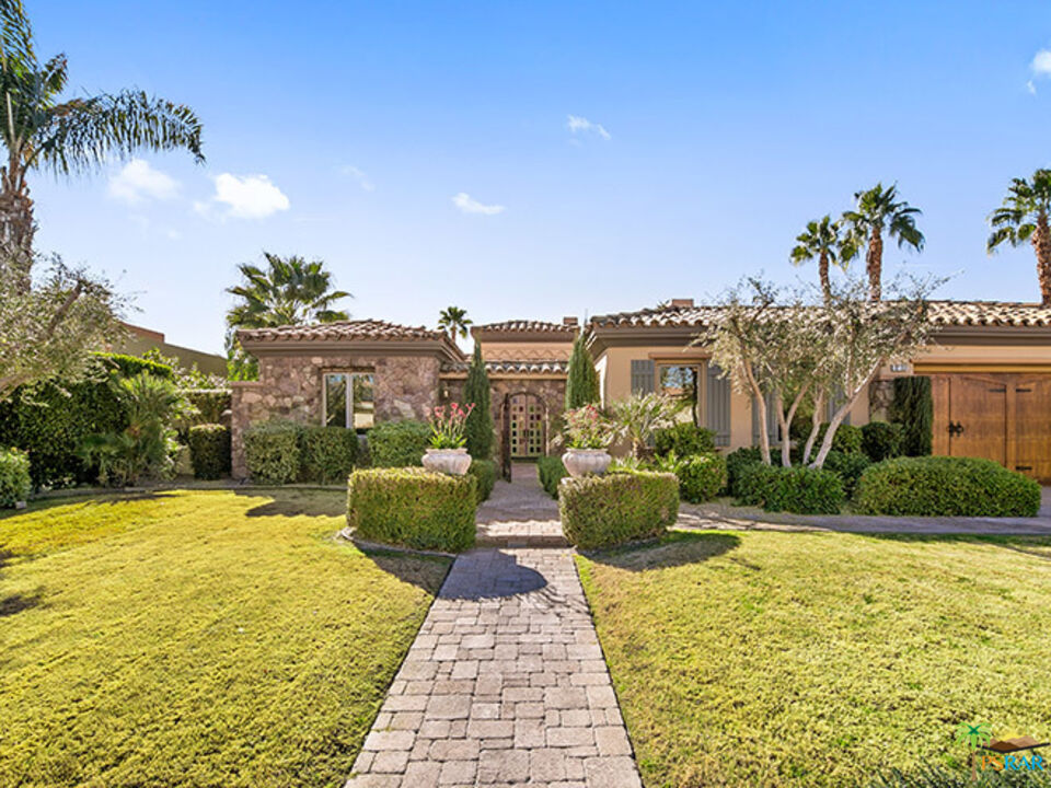 72733 Verbenia Road Rancho Mirage, CA 92270 - Photo 2 of 33 a view of a swimming pool and garden
