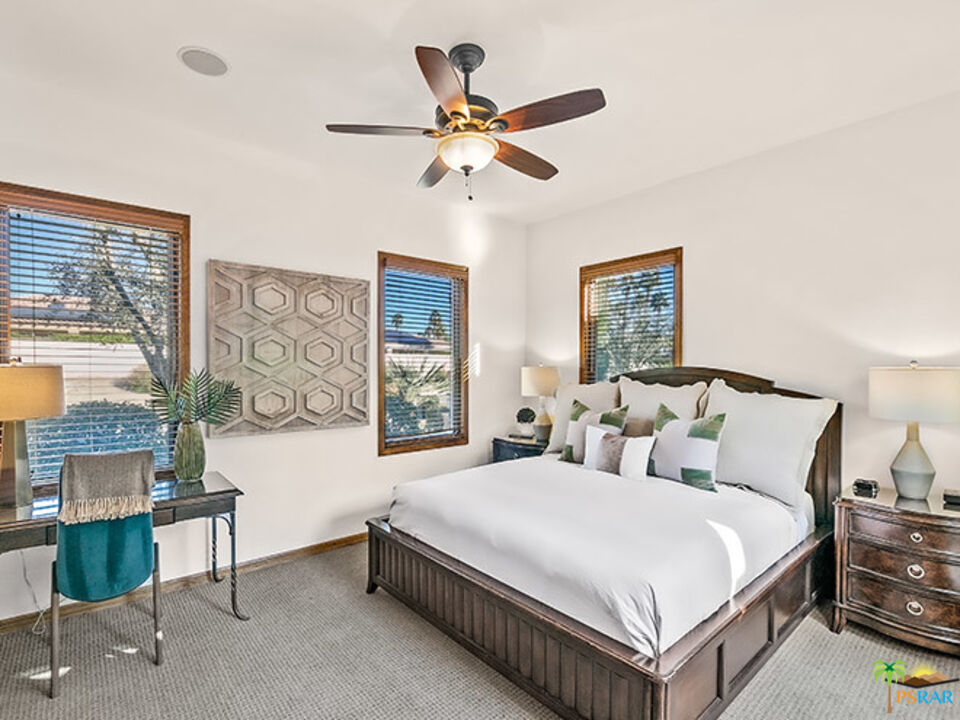 72733 Verbenia Road Rancho Mirage, CA 92270 - Photo 21 of 33 a bedroom with a bed a window and a potted plant