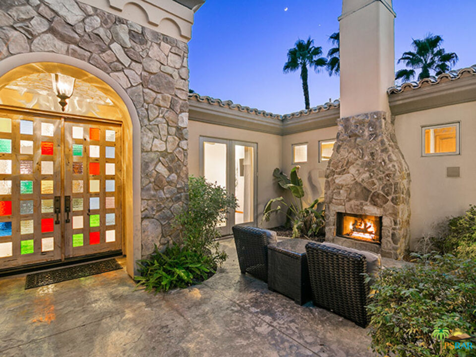 72733 Verbenia Road Rancho Mirage, CA 92270 - Photo 29 of 33 a view of a brick house with a large windows
