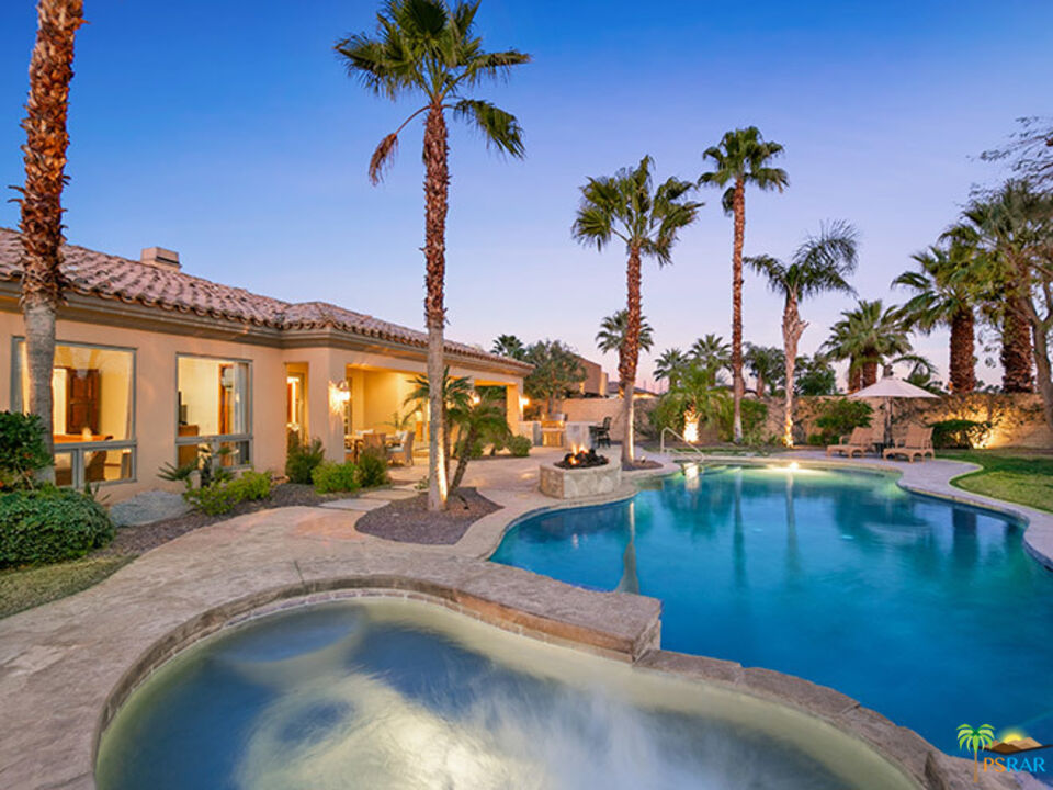 72733 Verbenia Road Rancho Mirage, CA 92270 - Photo 31 of 33 a view of a swimming pool with a table and chairs