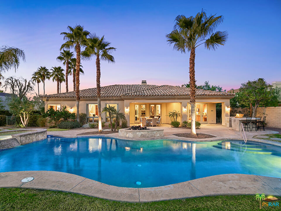 72733 Verbenia Road Rancho Mirage, CA 92270 - Photo 32 of 33 a view of a swimming pool with a table and chairs
