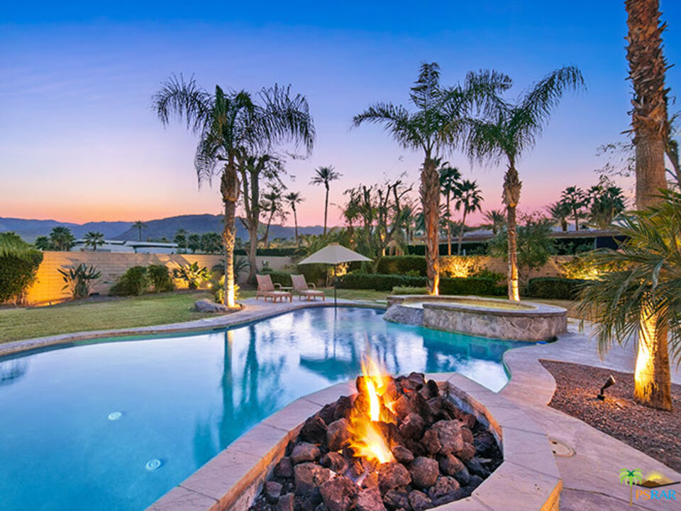 72733 Verbenia Road Rancho Mirage, CA 92270 - Photo 33 of 33 a view of a swimming pool with a patio and a garden