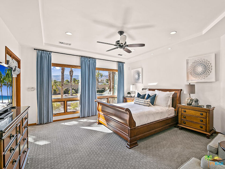 72733 Verbenia Road Rancho Mirage, CA 92270 - Photo 10 of 33 a bed room with a bed and a tv