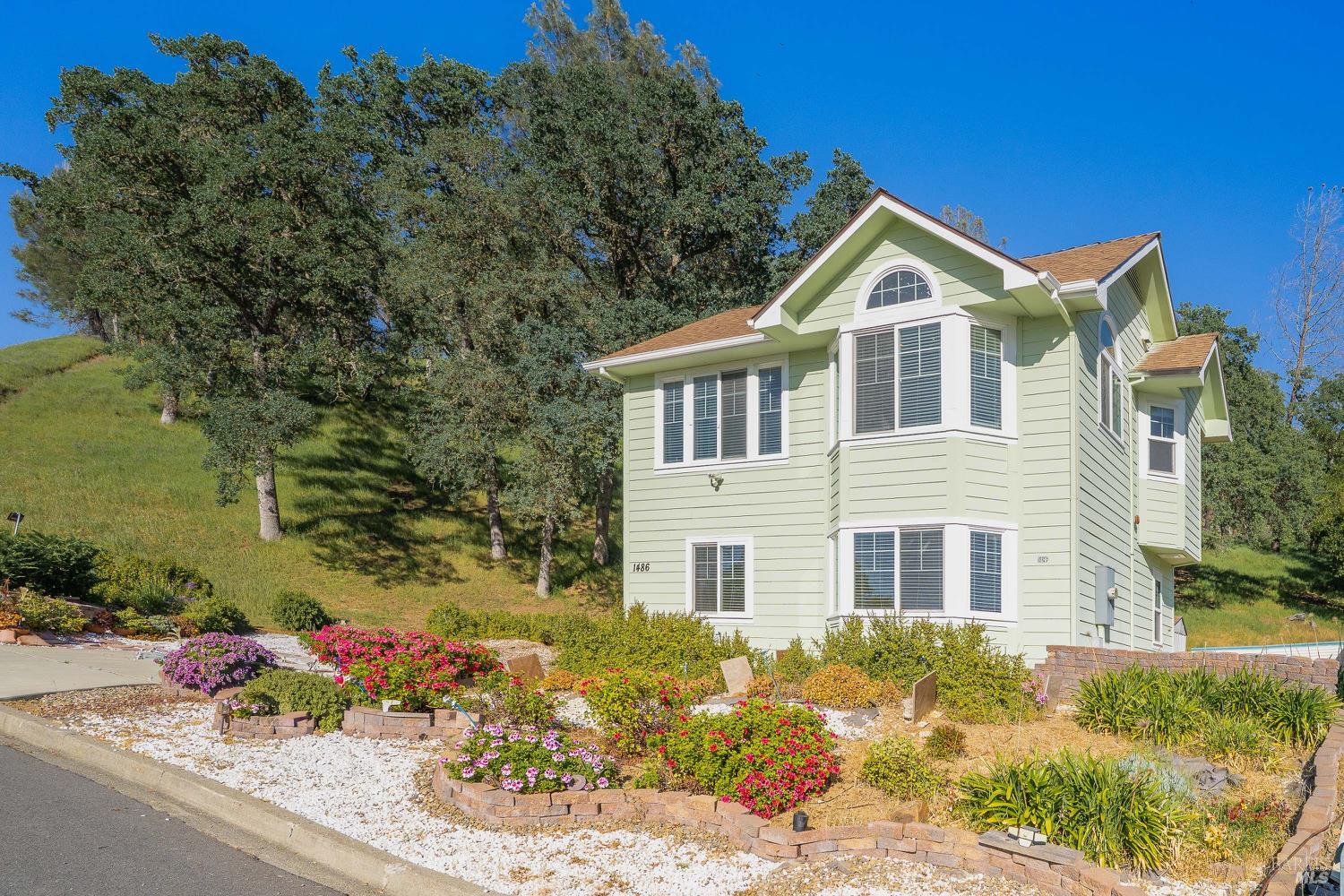 1486 Steele Canyon Road Napa, CA 94558 - Photo 1 of 46 a front view of a house with a yard