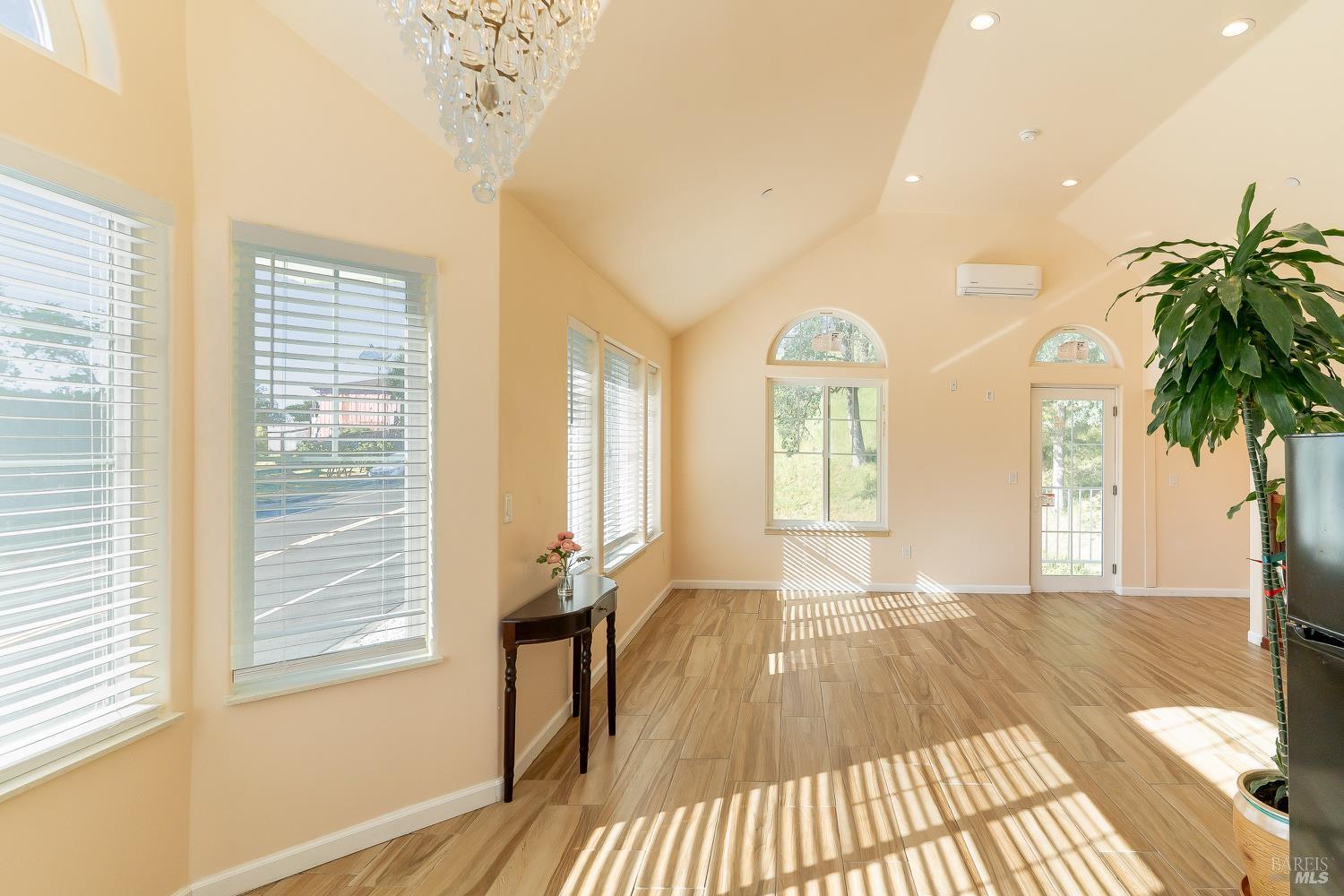 1486 Steele Canyon Road Napa, CA 94558 - Photo 13 of 46 a view of a room with wooden floor and windows