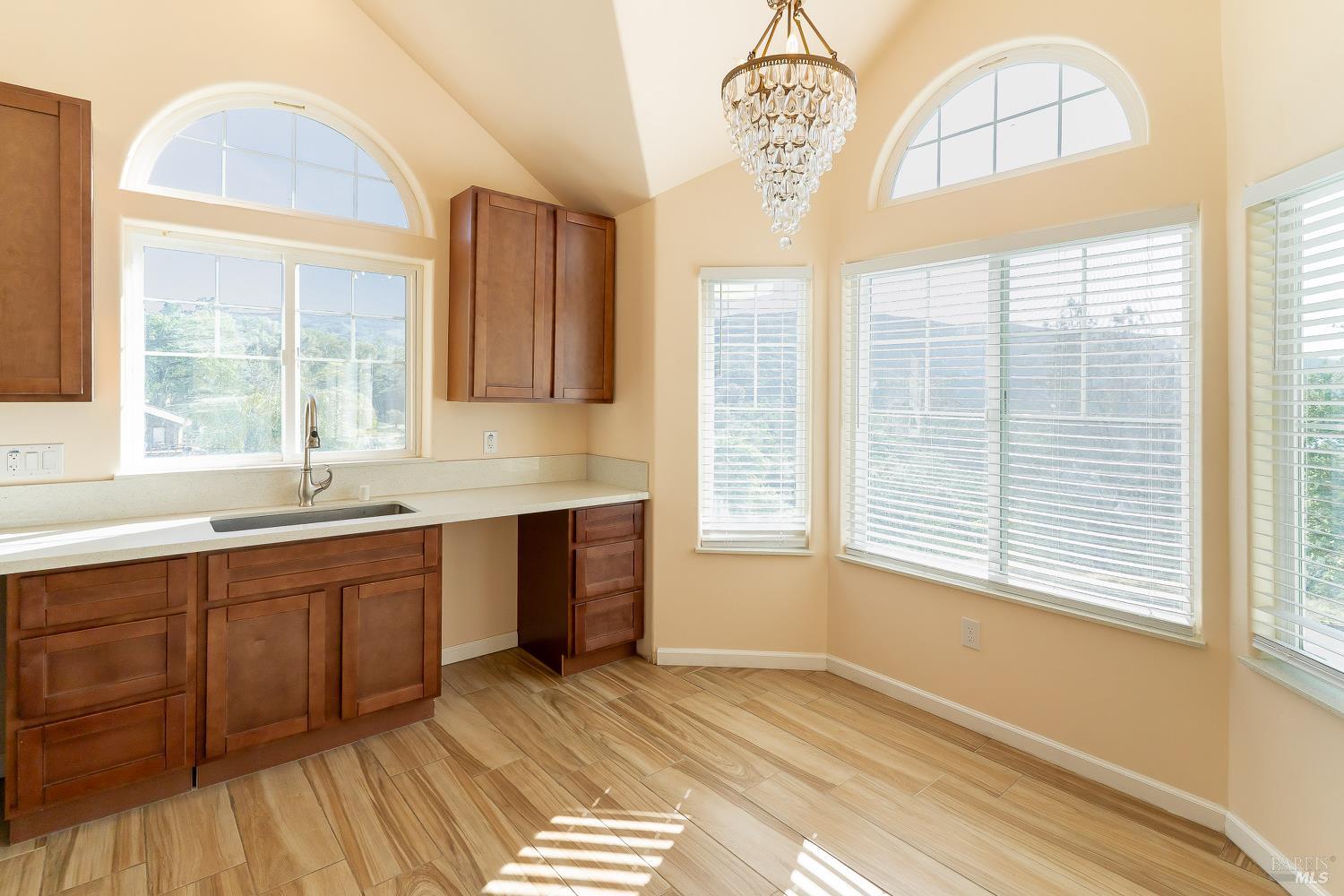 1486 Steele Canyon Road Napa, CA 94558 - Photo 15 of 46 a view of a kitchen with a sink dishwasher and wooden floor