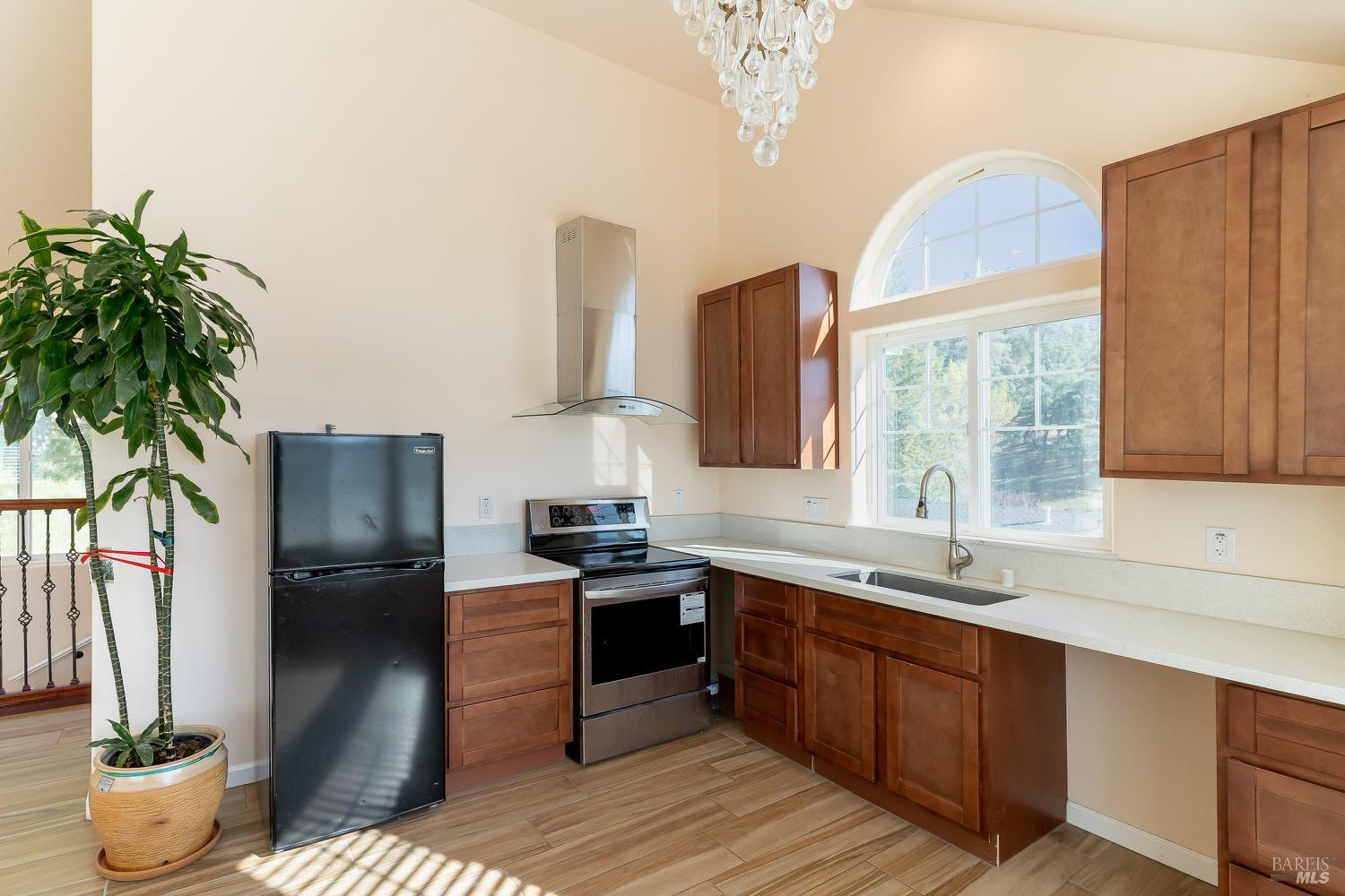1486 Steele Canyon Road Napa, CA 94558 - Photo 16 of 46 a kitchen with stainless steel appliances granite countertop a sink stove and refrigerator