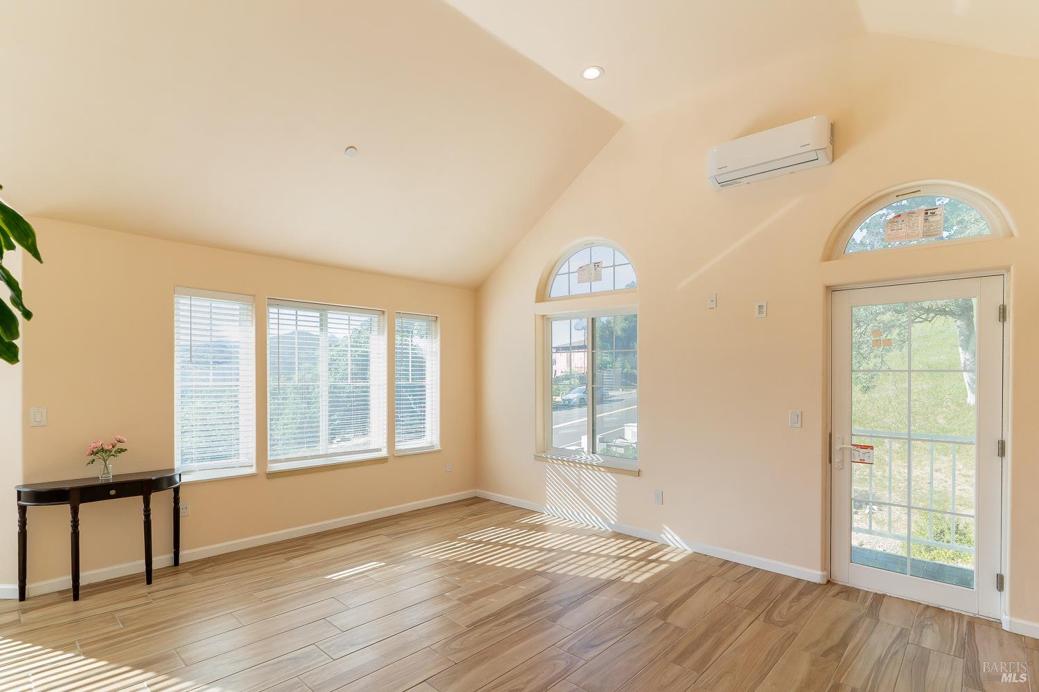 1486 Steele Canyon Road Napa, CA 94558 - Photo 18 of 46 an empty room with wooden floor and windows