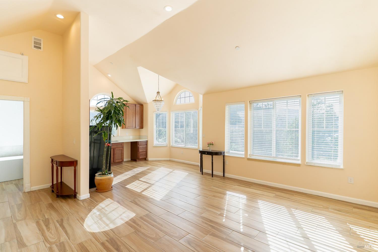 1486 Steele Canyon Road Napa, CA 94558 - Photo 19 of 46 a view of an empty room with glass door and windows