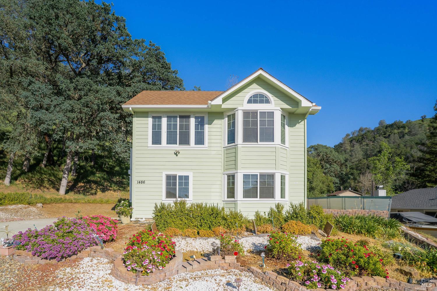 1486 Steele Canyon Road Napa, CA 94558 - Photo 2 of 46 a front view of a house with a yard
