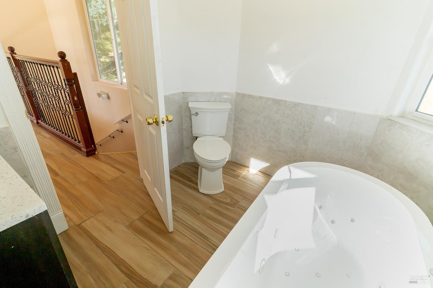 1486 Steele Canyon Road Napa, CA 94558 - Photo 21 of 46 a bathroom with a bathtub and toilet