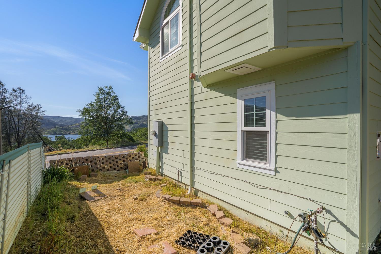 1486 Steele Canyon Road Napa, CA 94558 - Photo 34 of 46 a view of a small house with backyard