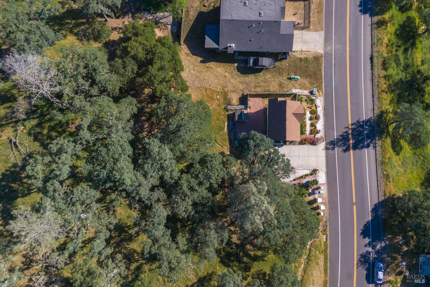 1486 Steele Canyon Road Napa, CA 94558 - Photo 44 of 46 an aerial view of a house with a yard and outdoor seating