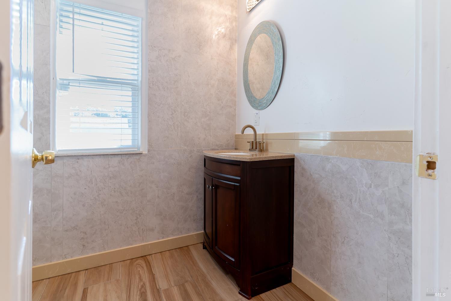1486 Steele Canyon Road Napa, CA 94558 - Photo 6 of 46 a bathroom with a sink and a mirror