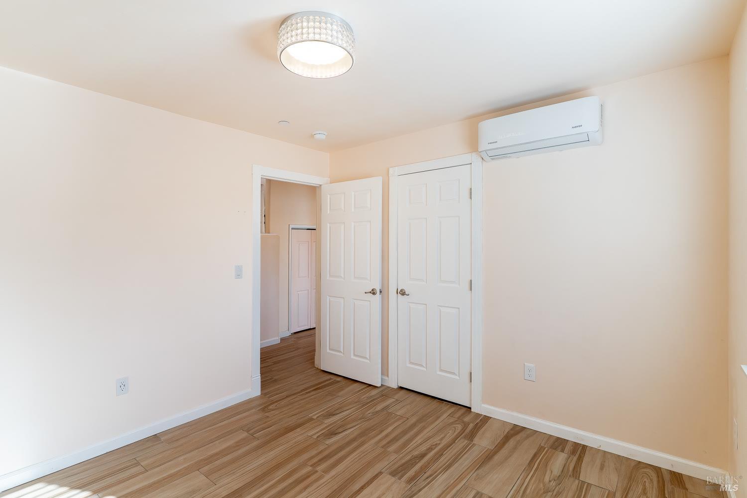 1486 Steele Canyon Road Napa, CA 94558 - Photo 10 of 46 a view of an empty room with wooden floor