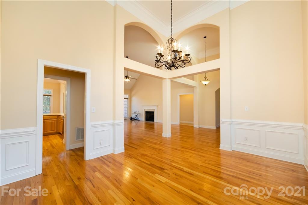 5858 Johnson Road Clover, SC 29710 - Photo 8 of 35 a view of a hallway with wooden floor and a dining room