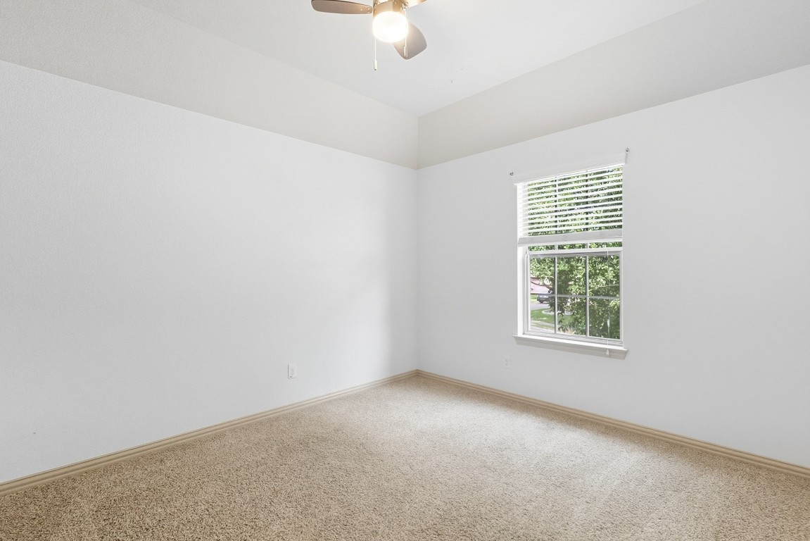 2409 Pauma Valley Way Pflugerville, TX 78660 - Photo 27 of 37 Spare room featuring carpet flooring and ceiling fan