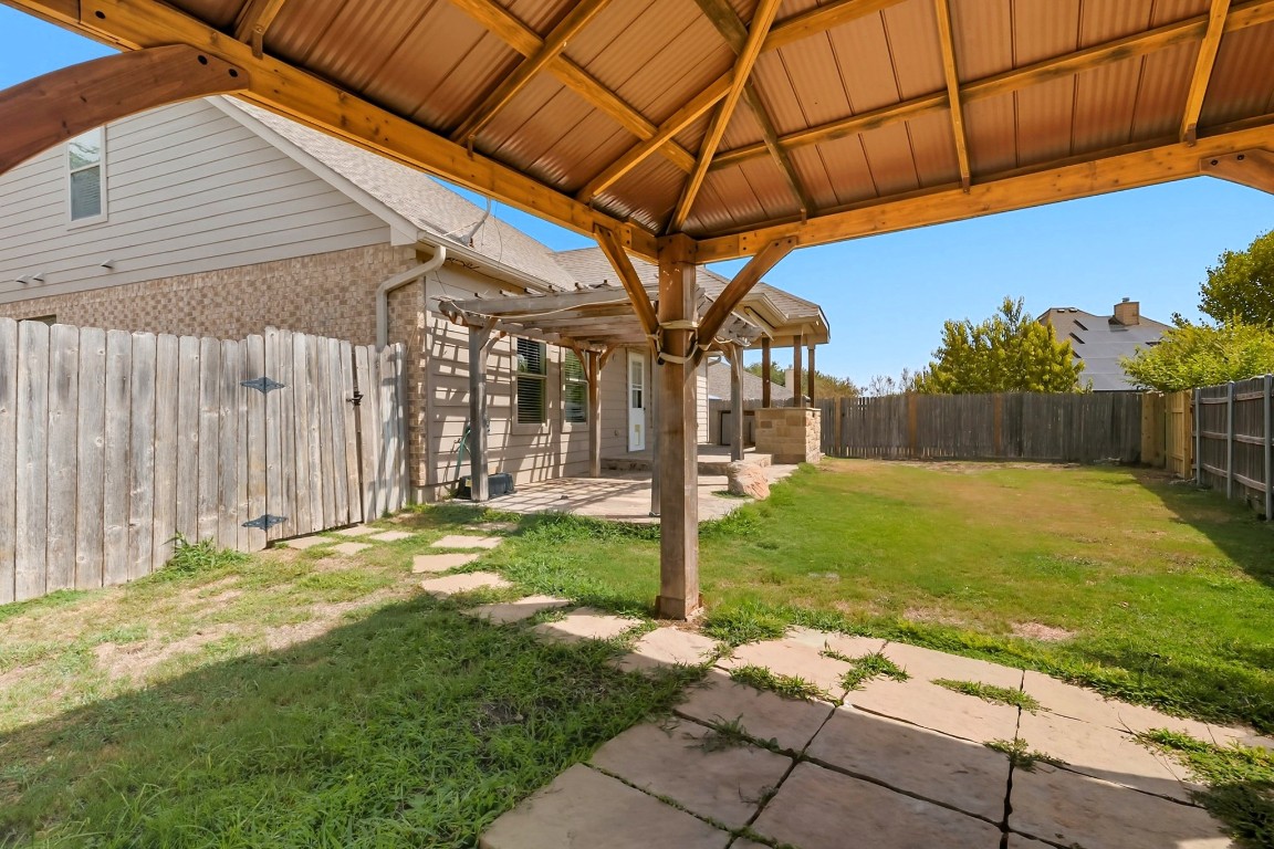 2409 Pauma Valley Way Pflugerville, TX 78660 - Photo 36 of 37 Fenced backyard featuring a patio area