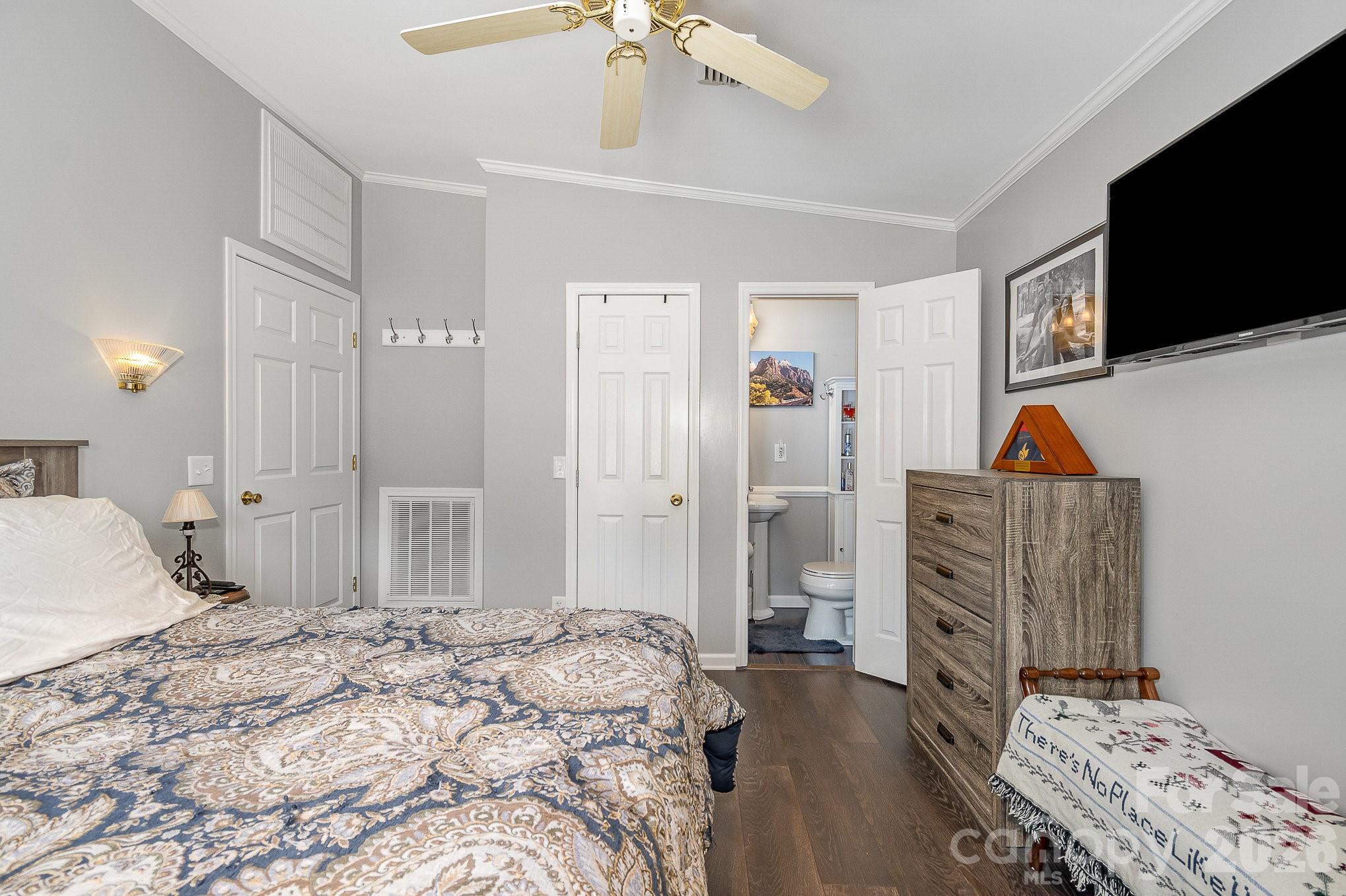 141 Badin Lake Road New London, NC 28127 - Photo 13 of 47 a bedroom with a bed and a flat screen tv
