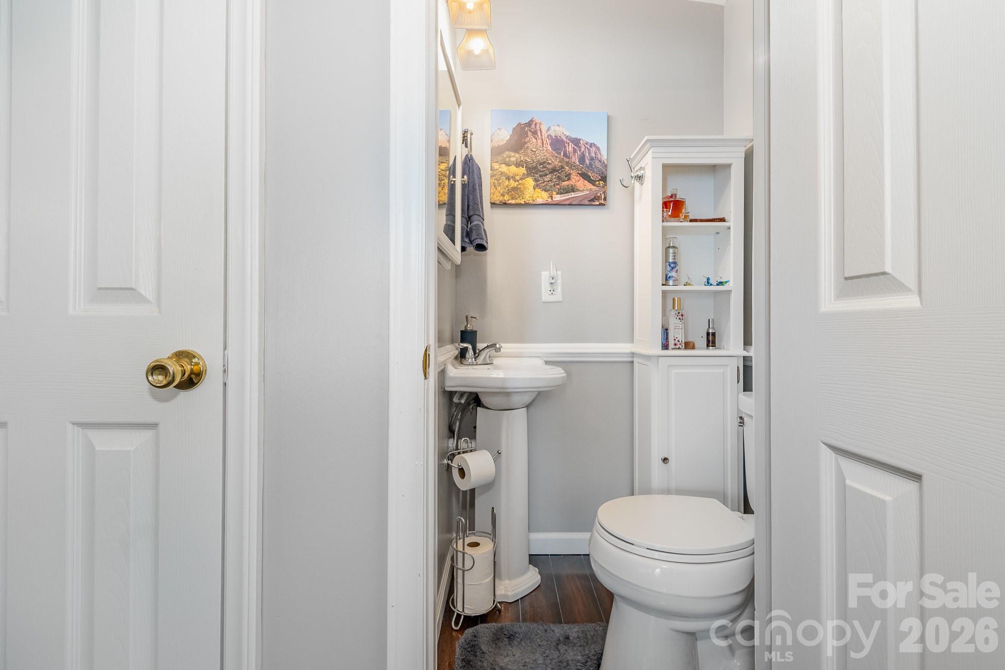 141 Badin Lake Road New London, NC 28127 - Photo 14 of 47 a bathroom with a toilet and sink